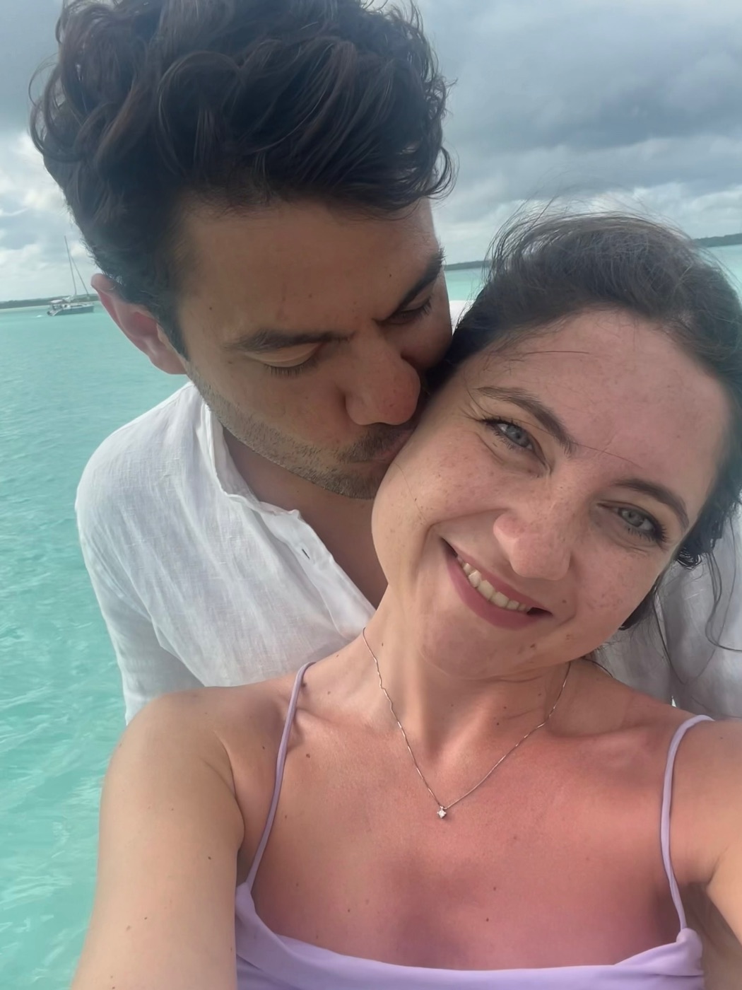 Eli and Rafa in turquoise water in Mexico
