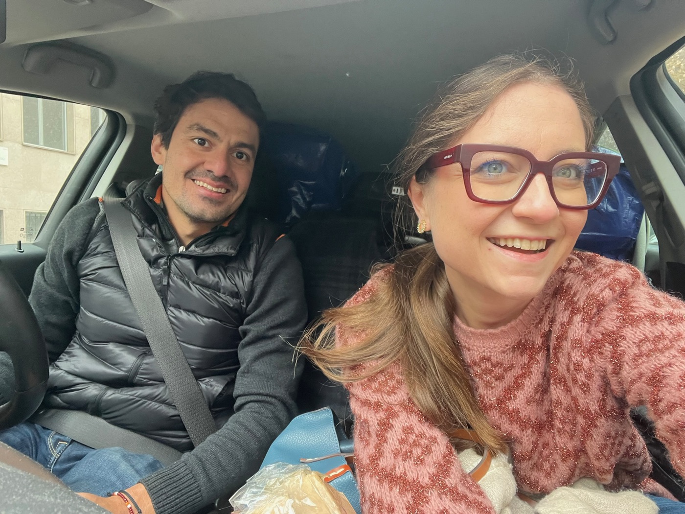Eli and Rafa in a car packed for a move